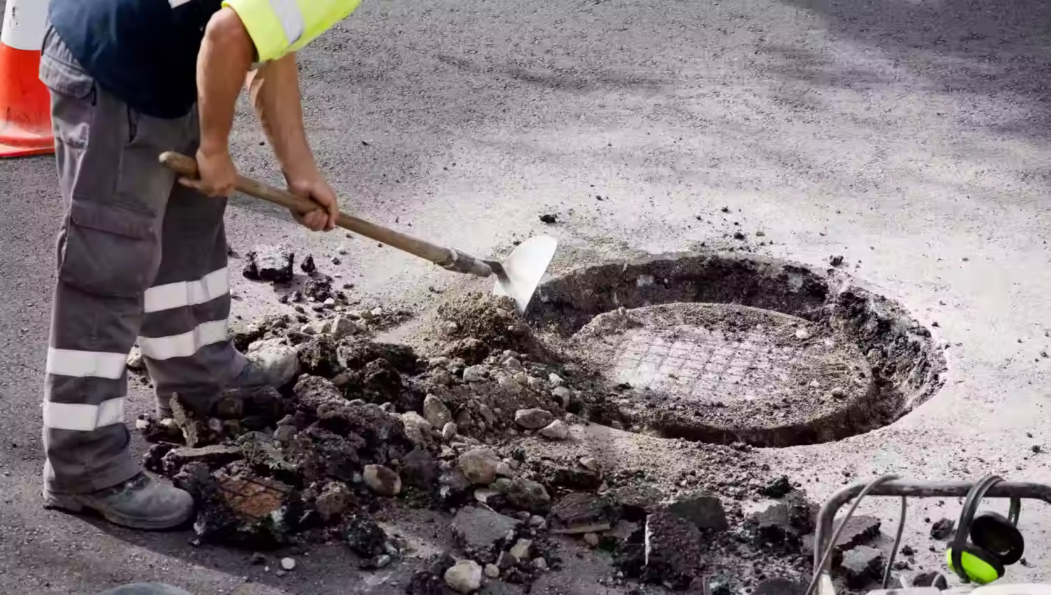 Manhole cover fixing